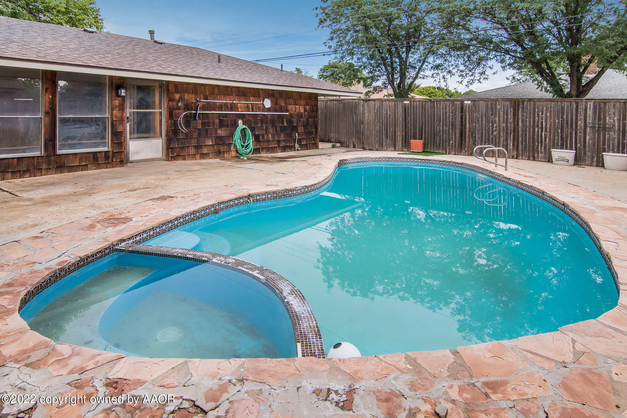 7720 Canode Drive Amarillo, TX 79121 - Photo 20 of 21 a swimming pool with outdoor seating and yard
