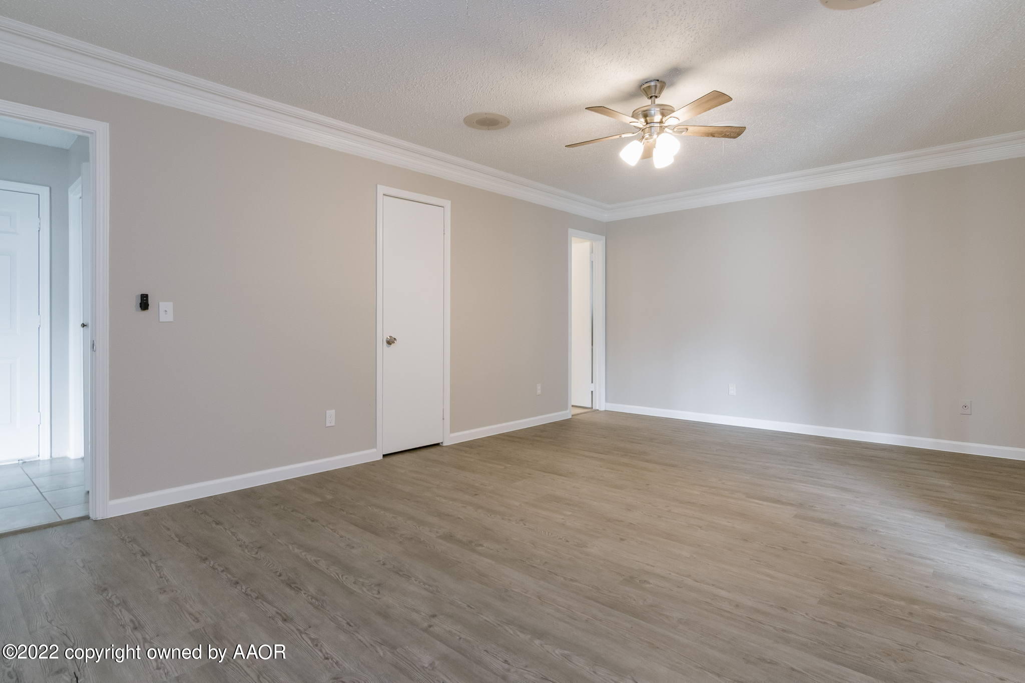 7720 Canode Drive Amarillo, TX 79121 - Photo 8 of 21 a view of an empty room with a ceiling fan and window