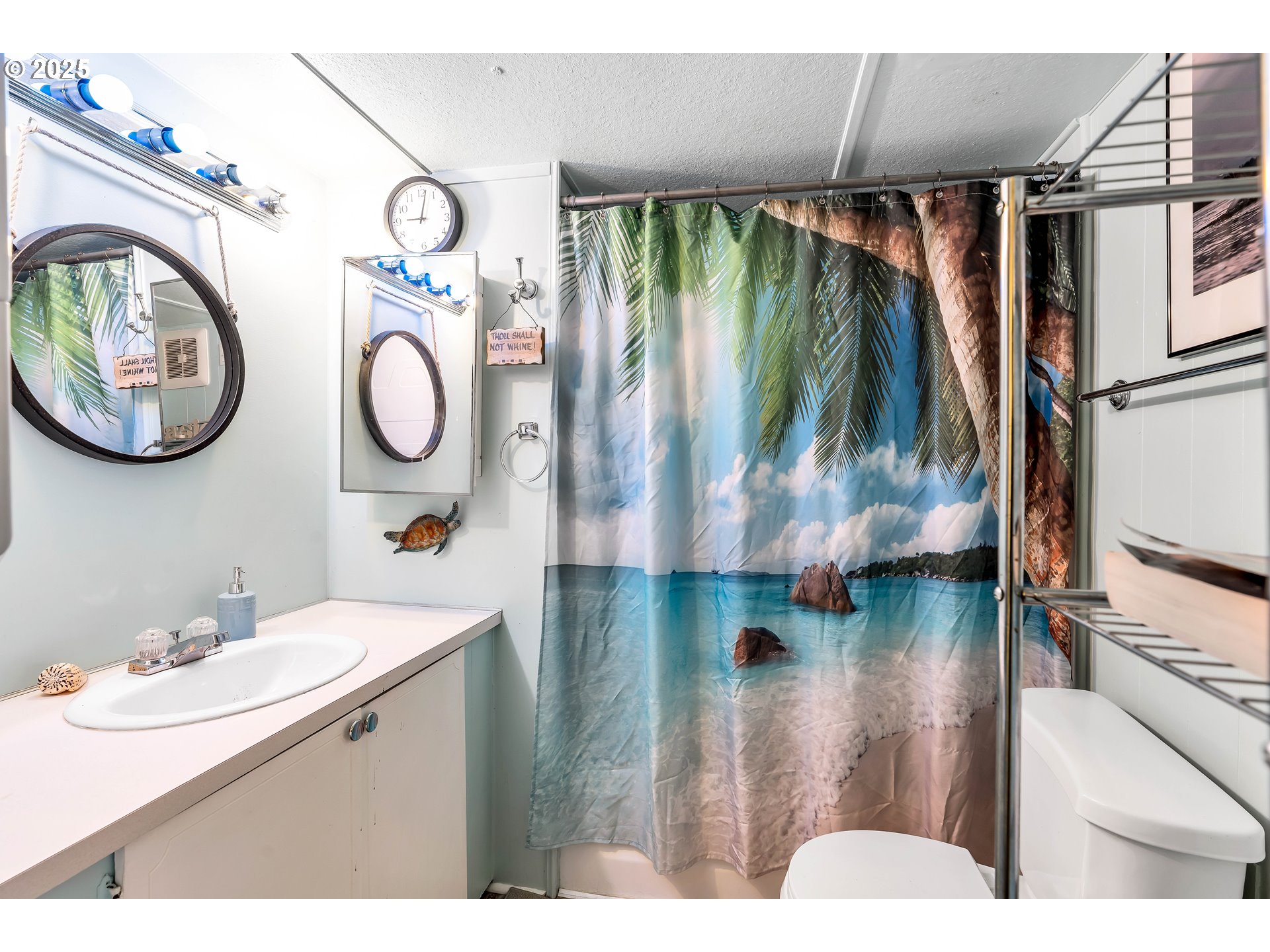23 3364 Sunnyview Road Salem, OR 97301 - Photo 12 of 22 a bathroom with a sink mirror and vanity