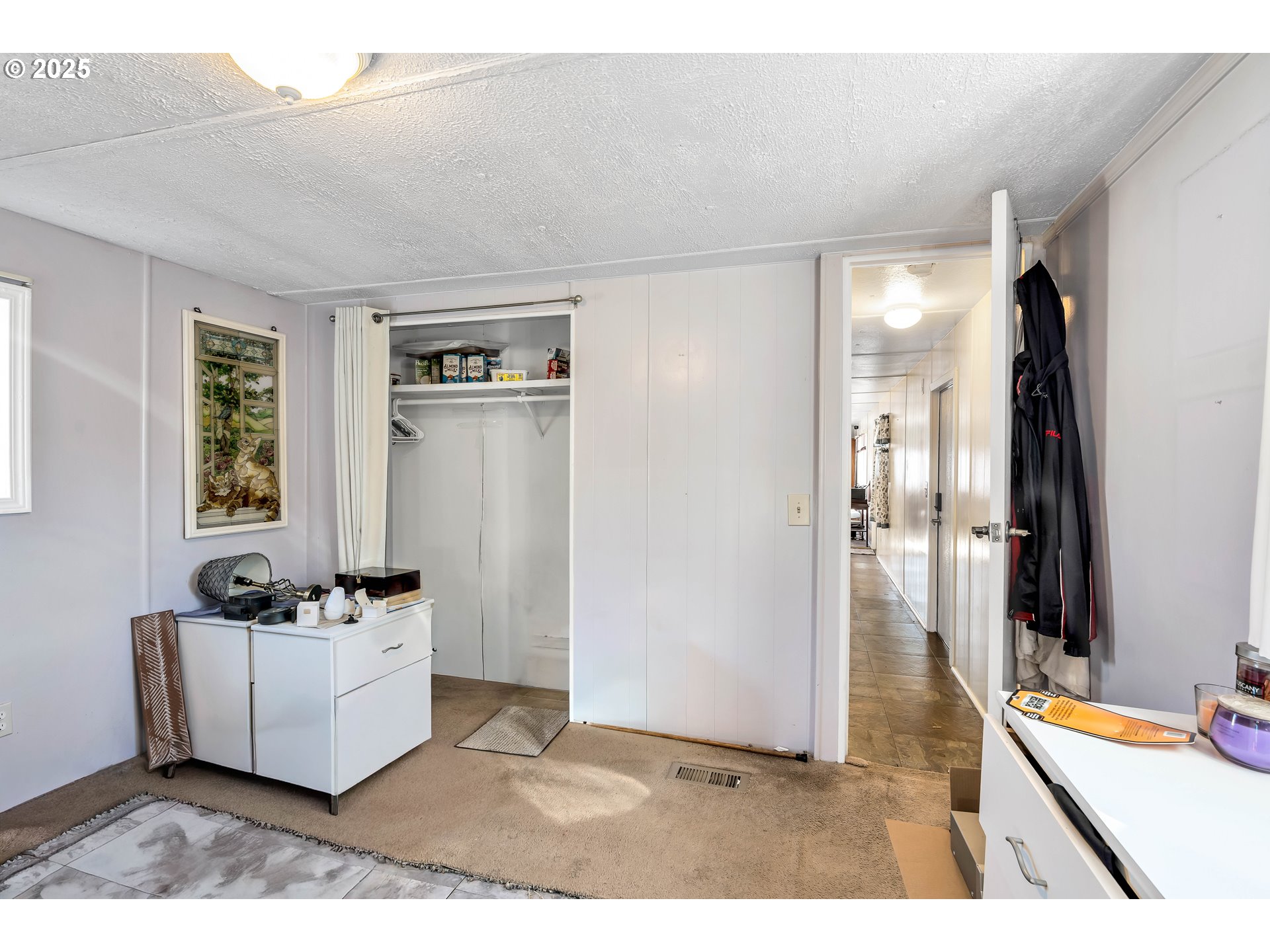 23 3364 Sunnyview Road Salem, OR 97301 - Photo 14 of 22 a living room with furniture and a flat screen tv
