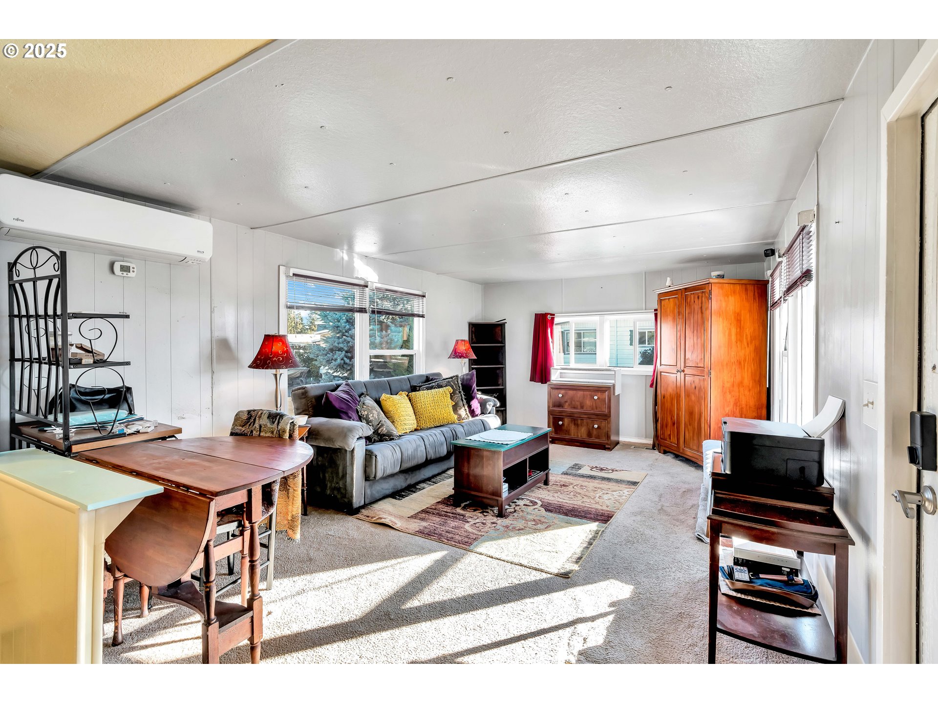 23 3364 Sunnyview Road Salem, OR 97301 - Photo 5 of 22 a living room with furniture a flat screen tv and a table