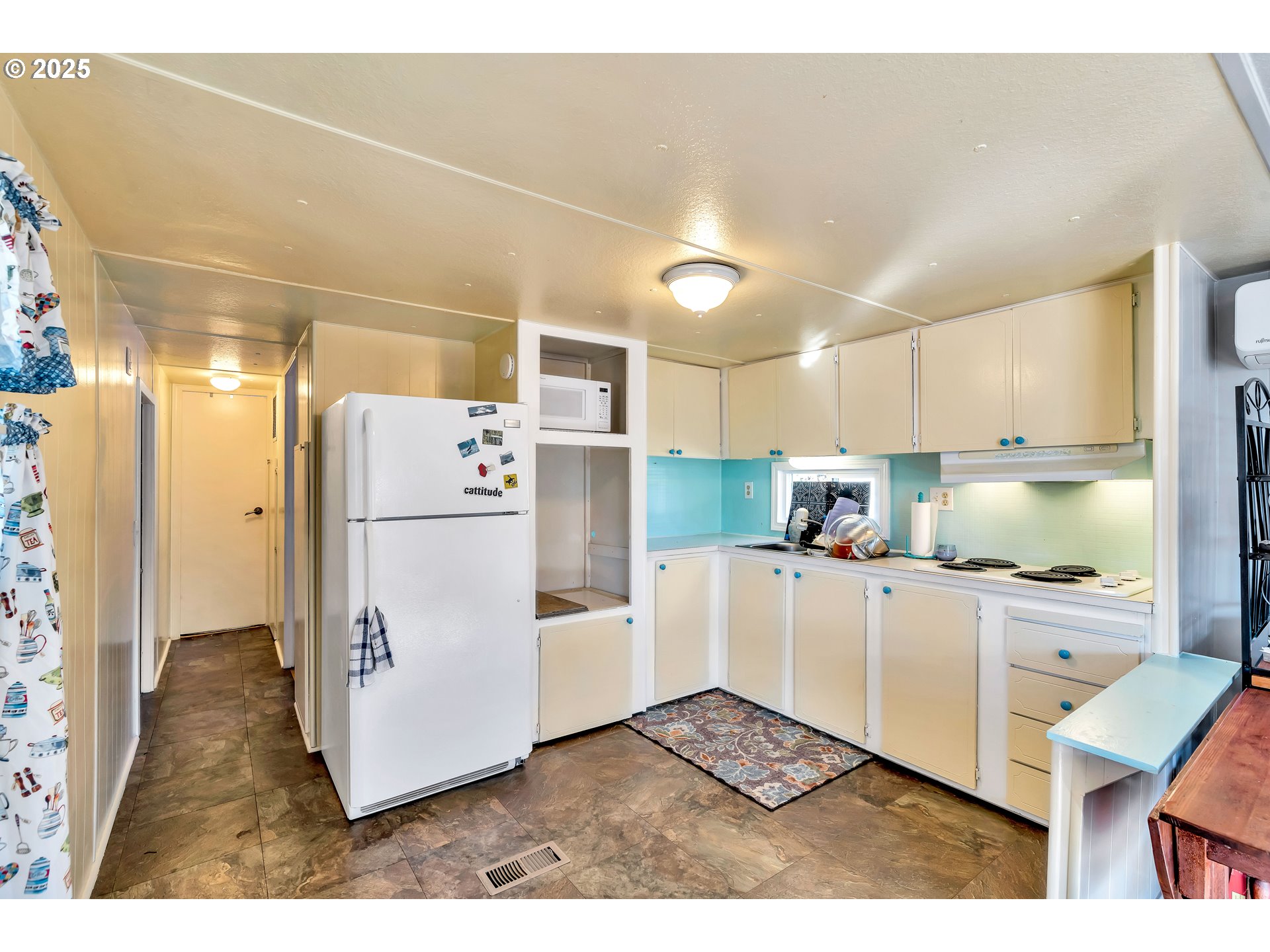 23 3364 Sunnyview Road Salem, OR 97301 - Photo 8 of 22 a kitchen with white cabinets and refrigerator