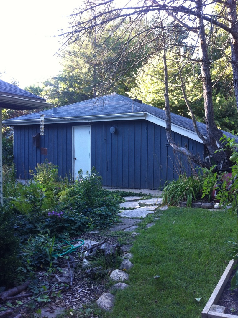 401 Woodbine Road Cary, IL 60013 - Photo 3 of 19 a backyard of a house with lots of green space