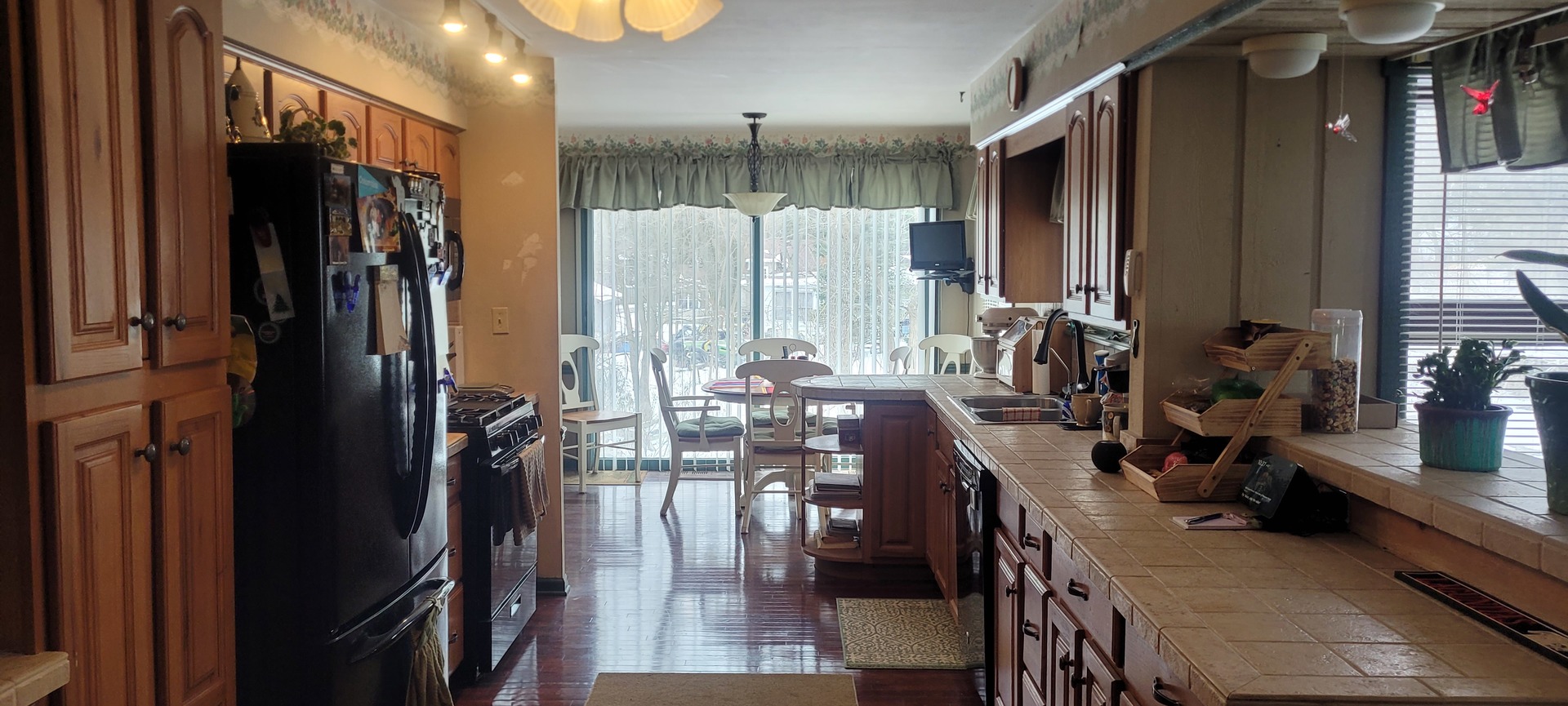 401 Woodbine Road Cary, IL 60013 - Photo 6 of 19 a view of a kitchen and dining room