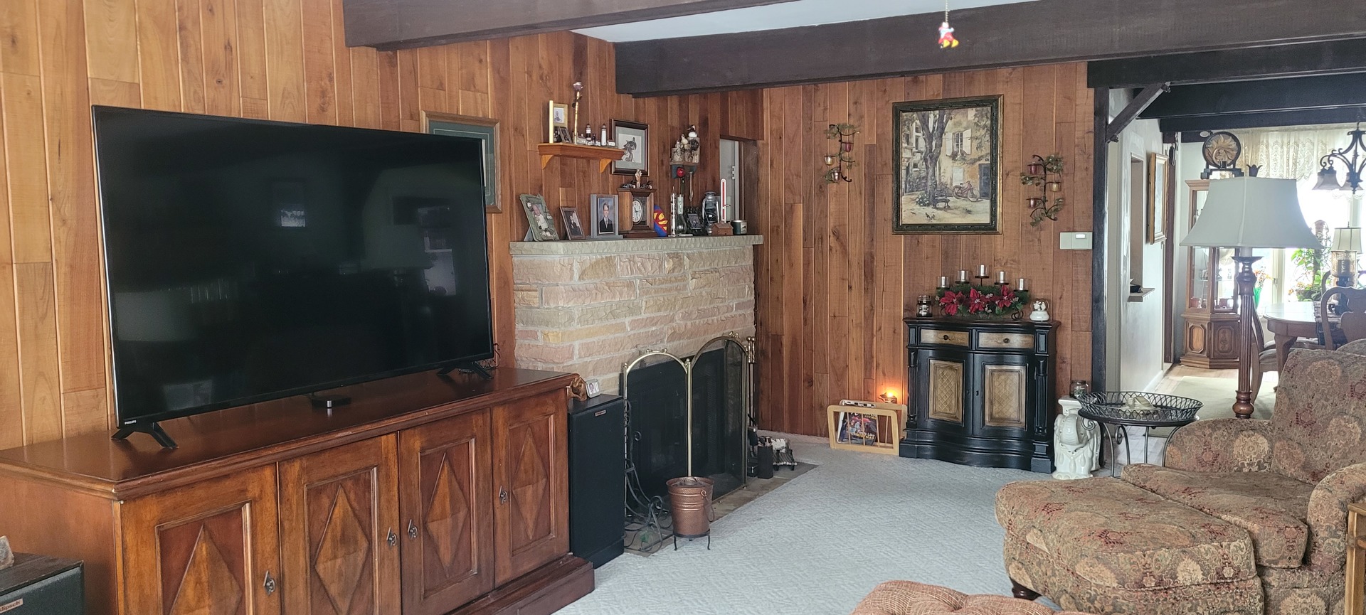 401 Woodbine Road Cary, IL 60013 - Photo 9 of 19 a living room with fireplace furniture and a flat screen tv