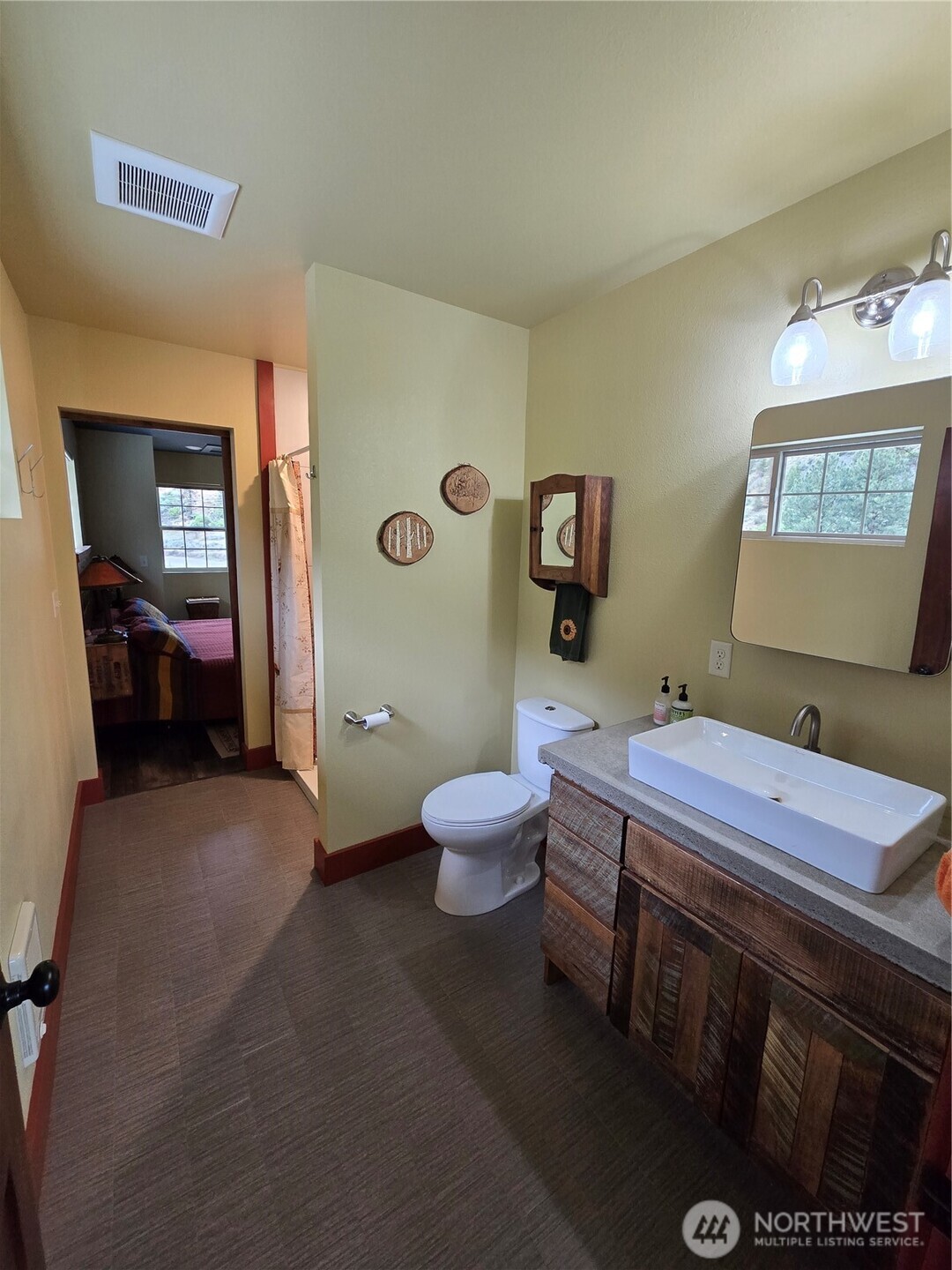 23 Allemandi Road Loomis, WA 98827 - Photo 17 of 23 a bathroom with a sink a toilet and a mirror