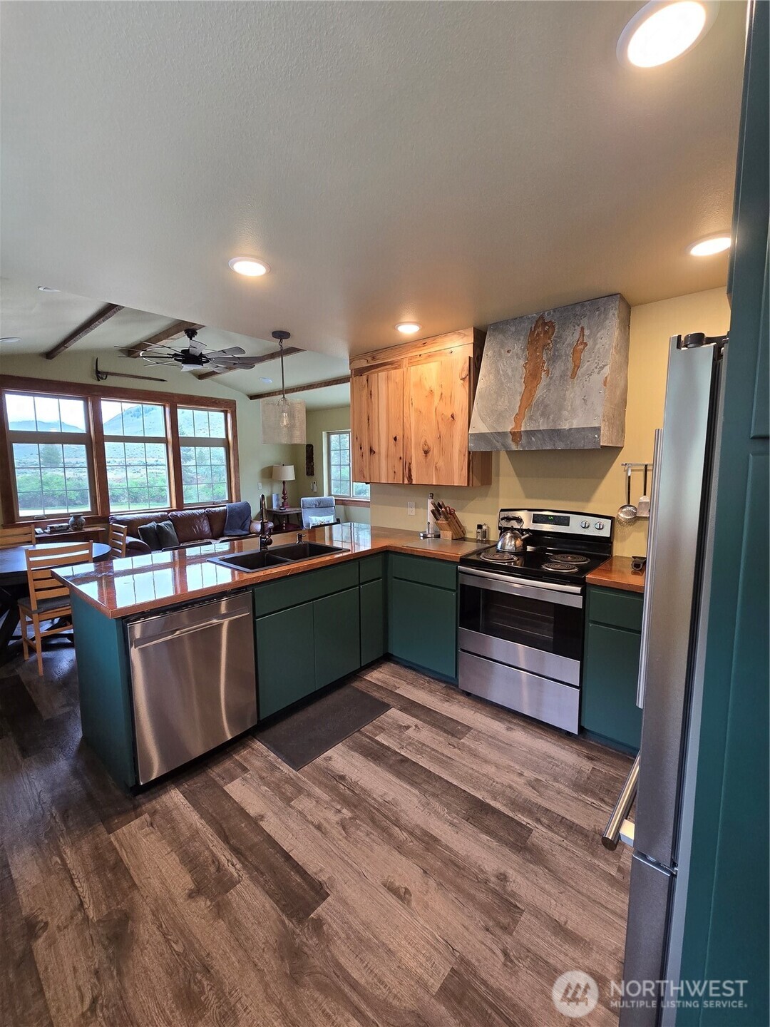23 Allemandi Road Loomis, WA 98827 - Photo 19 of 23 a kitchen with stainless steel appliances granite countertop a refrigerator a sink and a stove