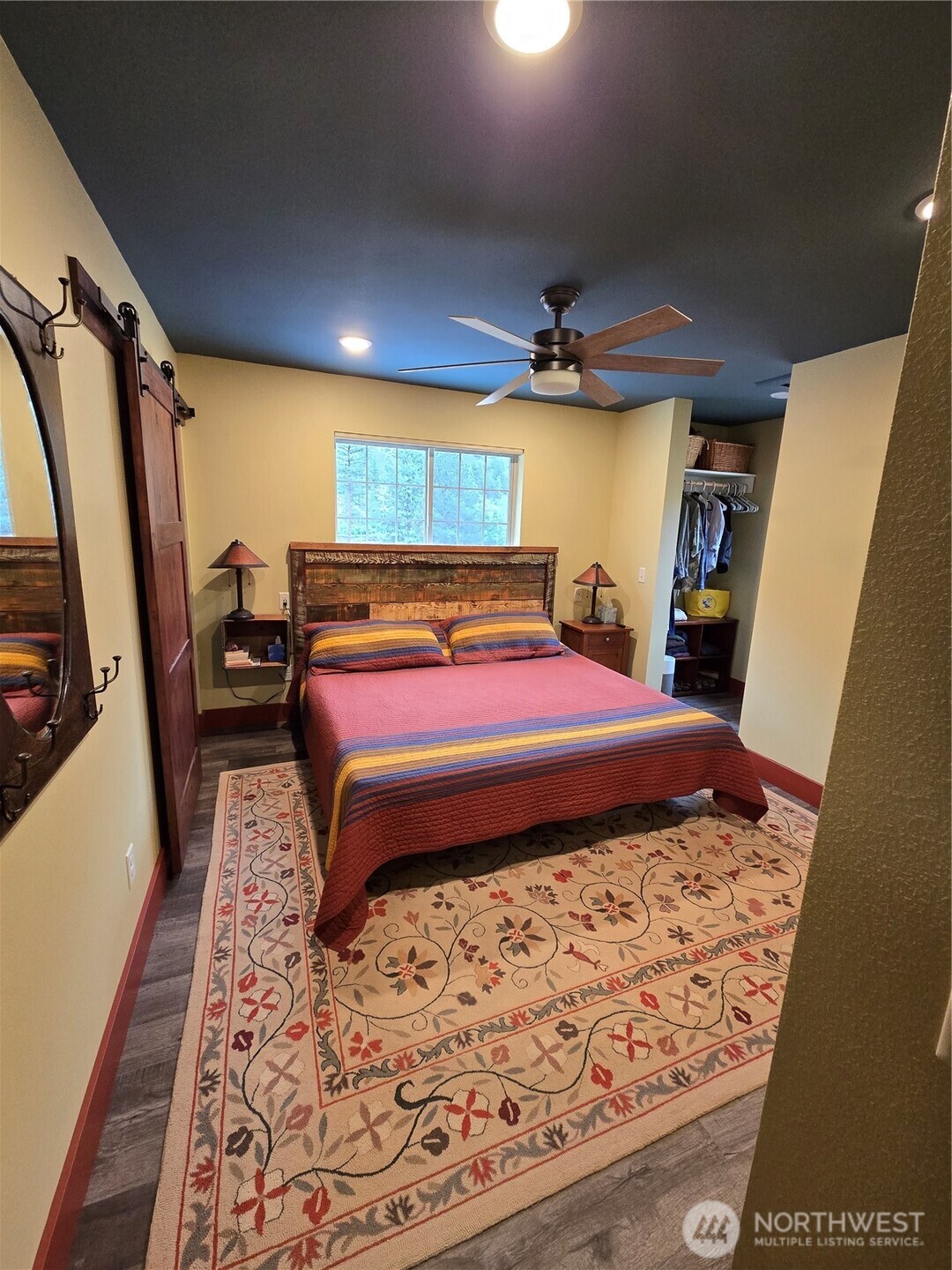 23 Allemandi Road Loomis, WA 98827 - Photo 20 of 23 a bedroom with a bed and wooden floor