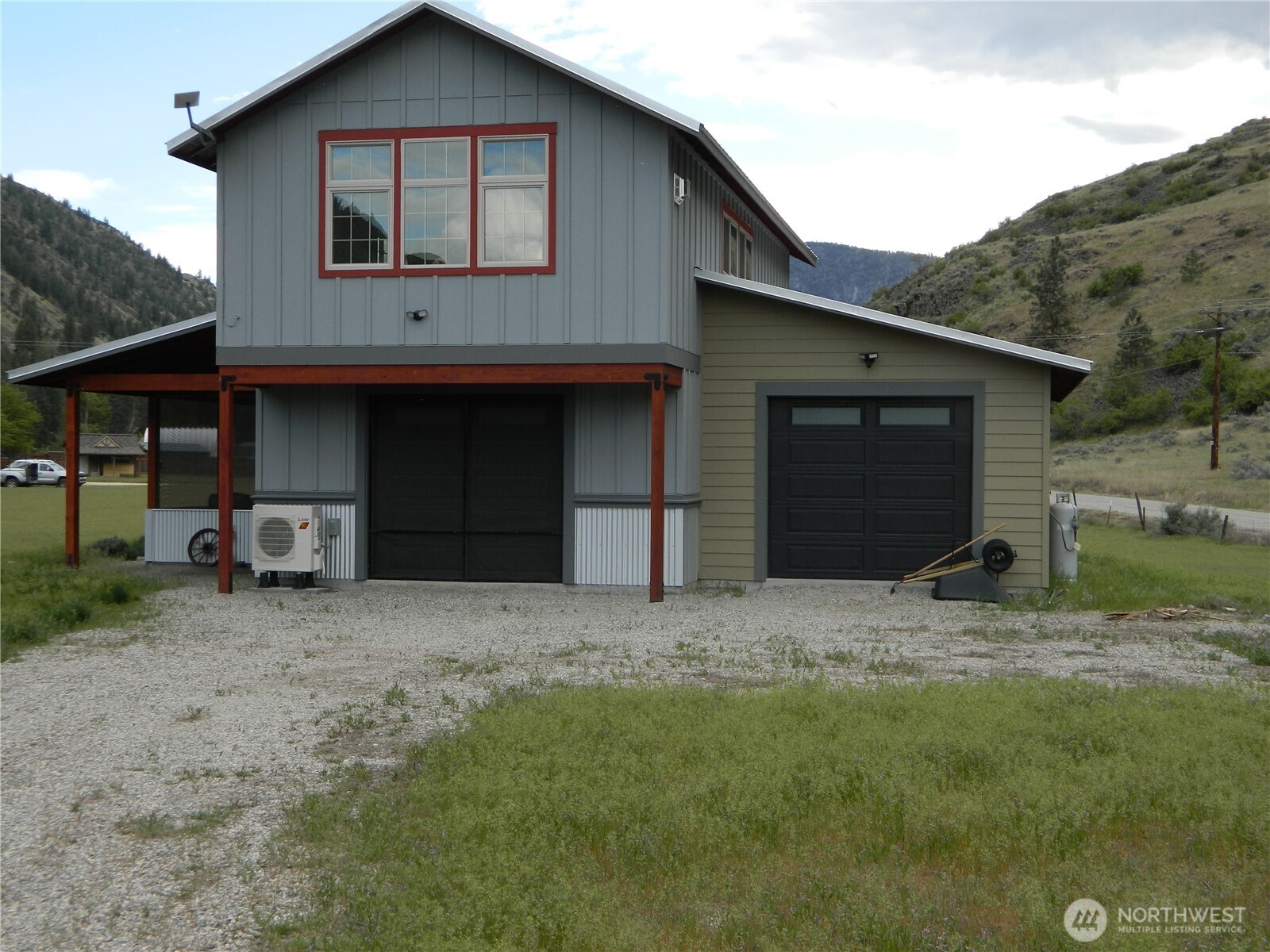 23 Allemandi Road Loomis, WA 98827 - Photo 3 of 23 a front view of a house with a yard and garage