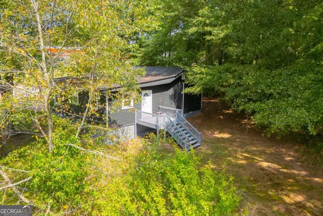 a view of a wooden house with a large window