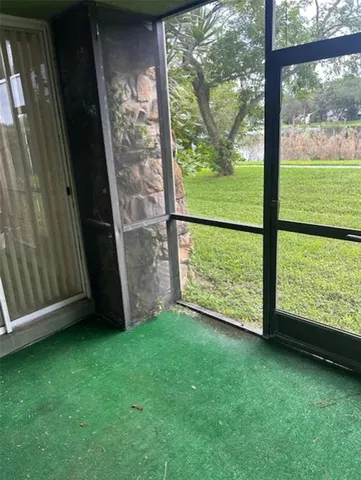 a view of a back yard from a room
