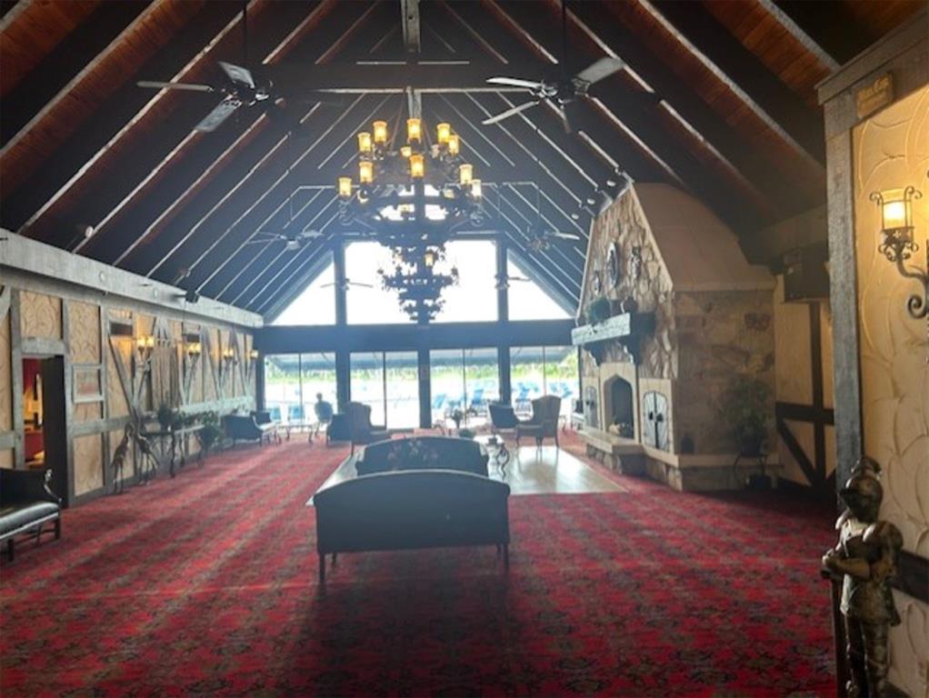 3720 Inverrary Drive, Unit 1T Lauderhill, FL 33319 - Photo 20 of 36 a lobby with furniture and chandelier