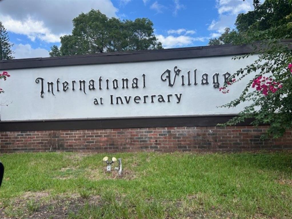 3720 Inverrary Drive, Unit 1T Lauderhill, FL 33319 - Photo 2 of 36 a sign on the side of the building