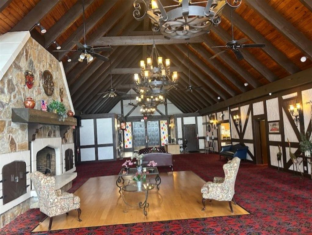 3720 Inverrary Drive, Unit 1T Lauderhill, FL 33319 - Photo 22 of 36 a view of a dining room with furniture a chandelier and wooden floor