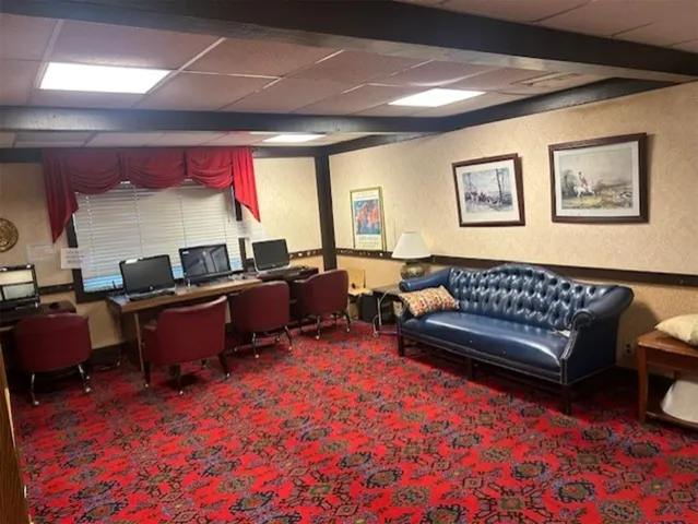 a living room with furniture and a rug