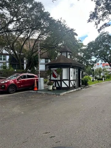 a view of street with parked cars