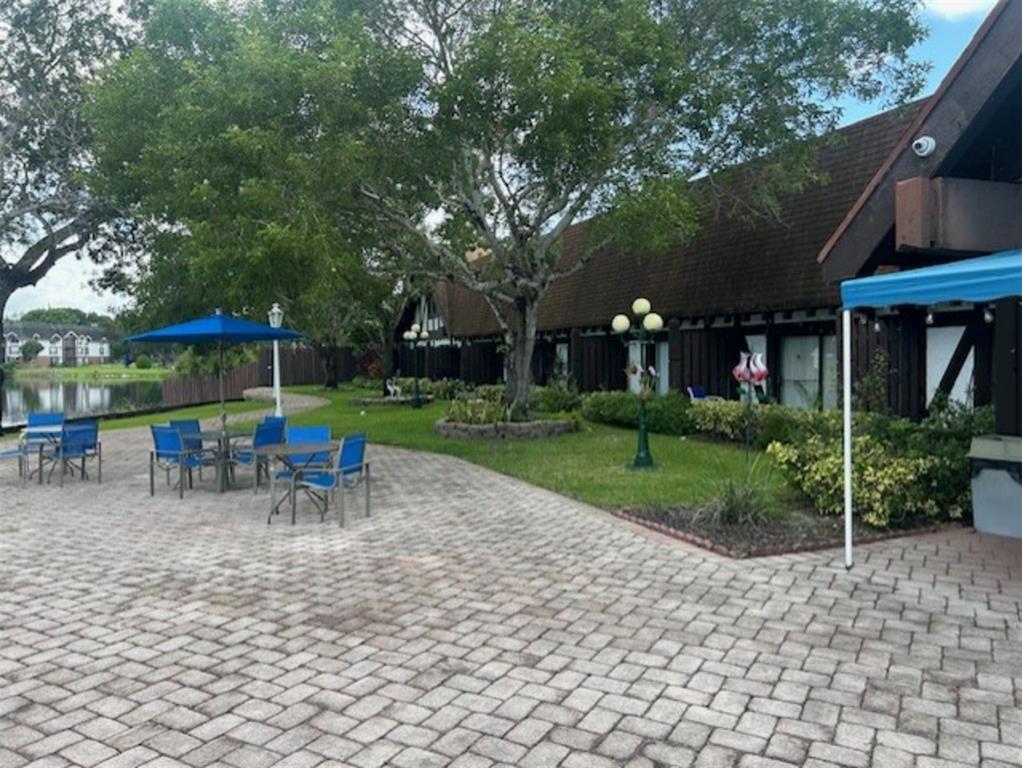 3720 Inverrary Drive, Unit 1T Lauderhill, FL 33319 - Photo 30 of 36 a view of a park with furniture and garden