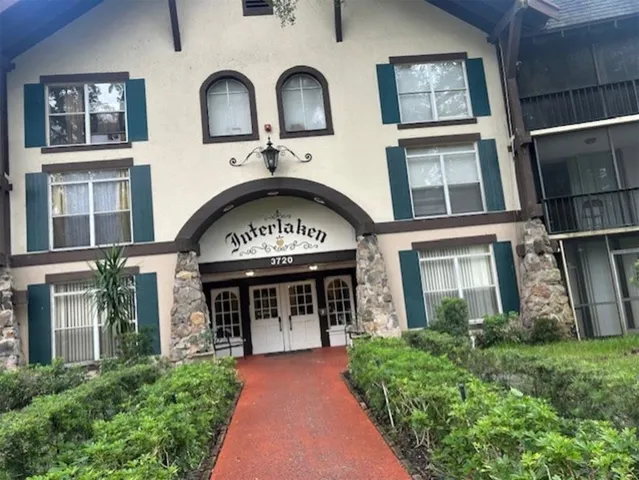 a view of a street with cars parked