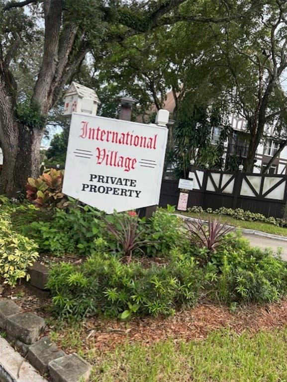 3720 Inverrary Drive, Unit 1T Lauderhill, FL 33319 - Photo 33 of 36 a sign on the side of the tree