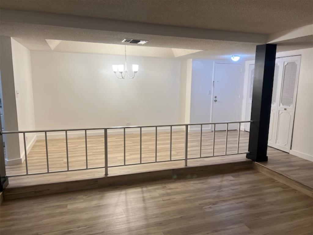 3720 Inverrary Drive, Unit 1T Lauderhill, FL 33319 - Photo 6 of 36 a view of staircase with wooden floor and window
