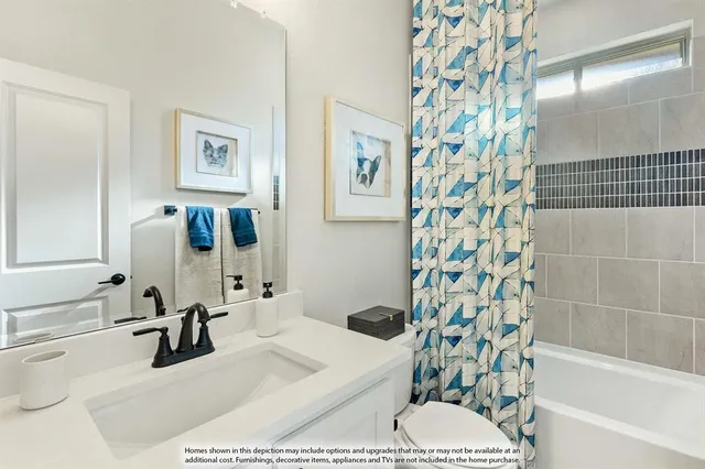 a living room with furniture a large window and a fireplace