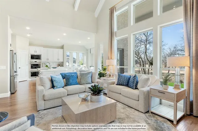 a living room with furniture fireplace and a table