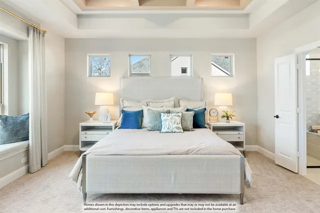 a bedroom with furniture and a large window