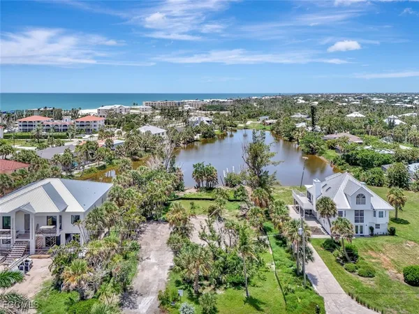 an aerial view of a house with a lake view