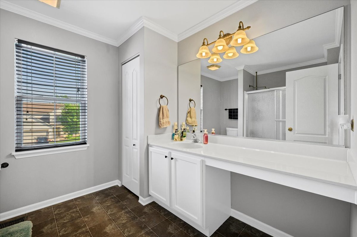 322 Zinnia Drive Romeoville, IL 60446 - Photo 23 of 42 a bathroom with a sink mirror and vanity