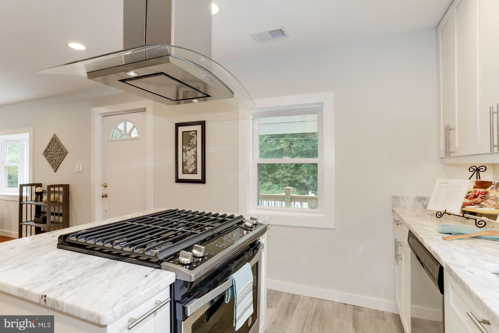 4303 Ivy Glen Road Silver Spring, MD 20906 - Photo 11 of 30 a kitchen with a stove and a sink