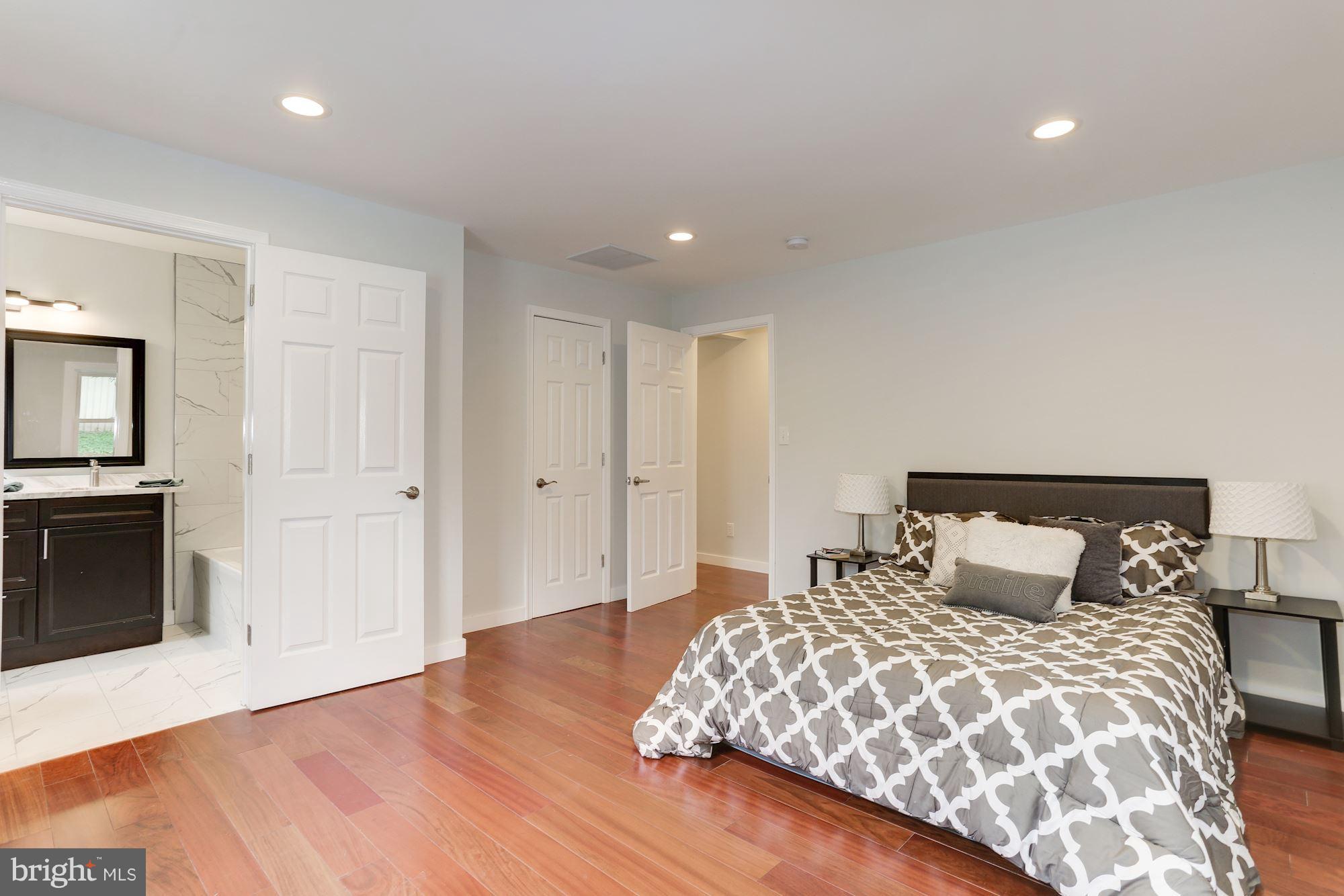 4303 Ivy Glen Road Silver Spring, MD 20906 - Photo 12 of 30 a bedroom with a bed and a television