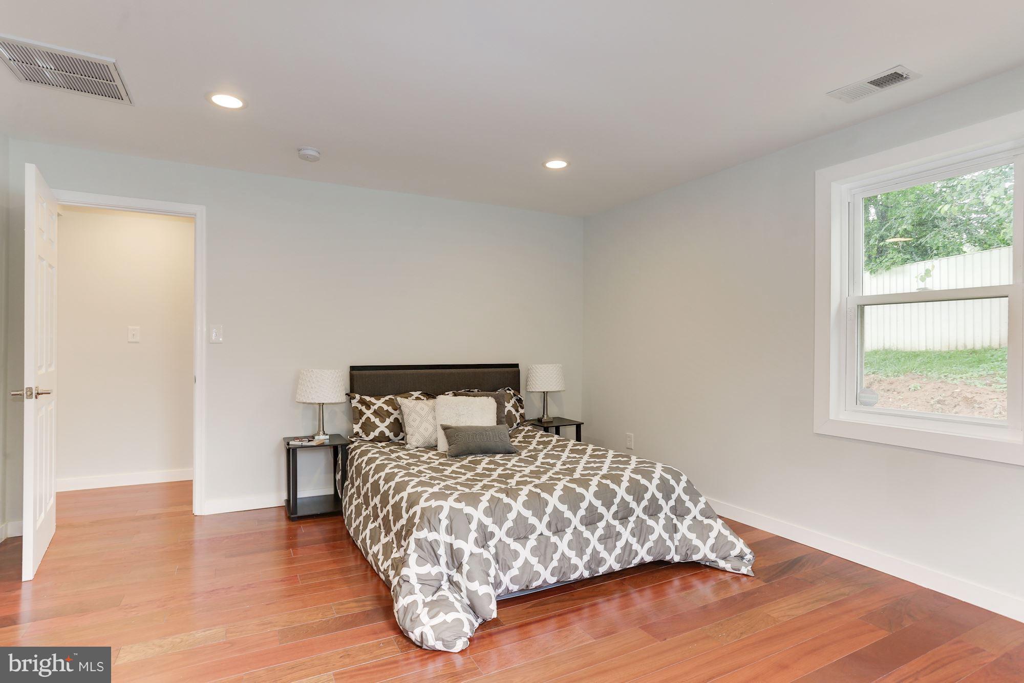 4303 Ivy Glen Road Silver Spring, MD 20906 - Photo 13 of 30 a bedroom with a bed and window