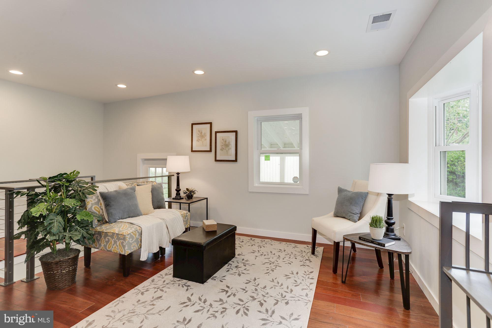 4303 Ivy Glen Road Silver Spring, MD 20906 - Photo 4 of 30 a living room with furniture wooden floor and a window