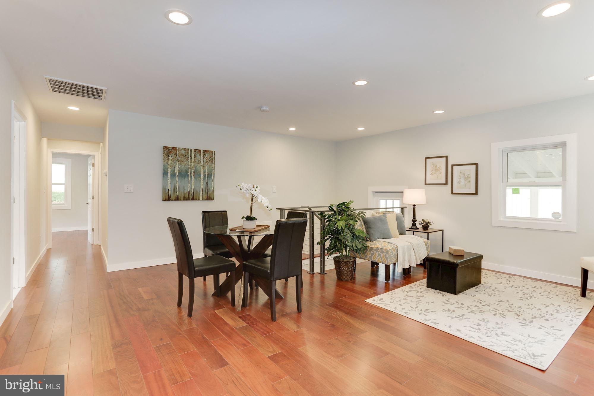 4303 Ivy Glen Road Silver Spring, MD 20906 - Photo 5 of 30 a view of a dining room with furniture and wooden floor