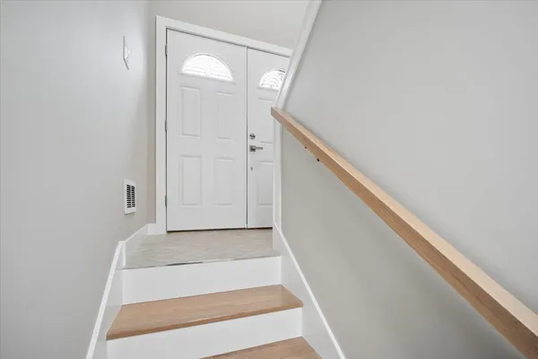 a view of a hallway with staircase