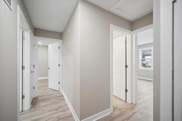 a view of a bathroom from the hallway