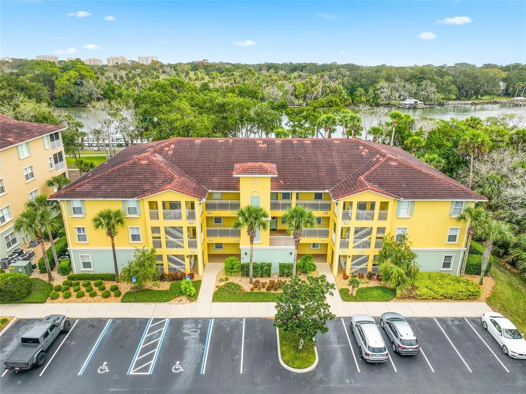 100 Canopy Walk Lane, Unit 133 Palm Coast, FL 32137 - Photo 1 of 51 an aerial view of a house with yard swimming pool and outdoor seating