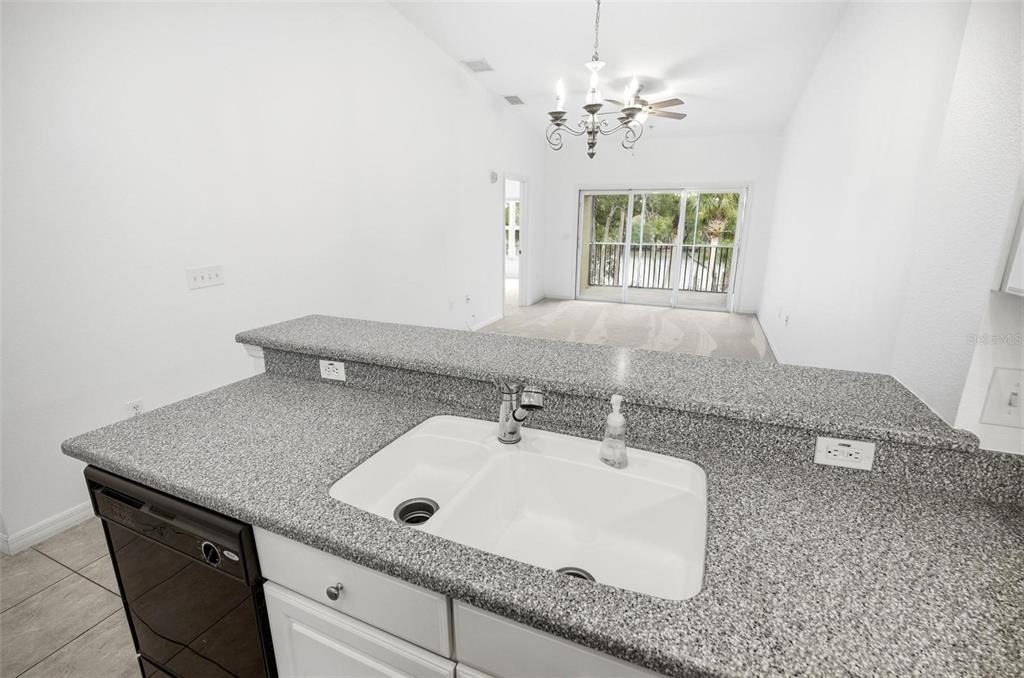 100 Canopy Walk Lane, Unit 133 Palm Coast, FL 32137 - Photo 11 of 51 a bathroom with a sink granite and a window