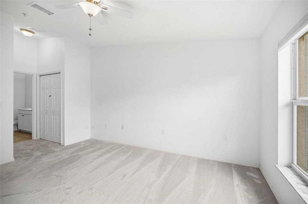 100 Canopy Walk Lane, Unit 133 Palm Coast, FL 32137 - Photo 16 of 51 an empty room with a window