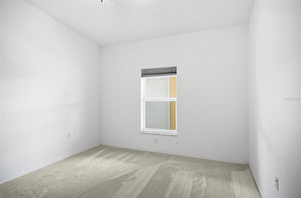 100 Canopy Walk Lane, Unit 133 Palm Coast, FL 32137 - Photo 18 of 51 an empty room with a window