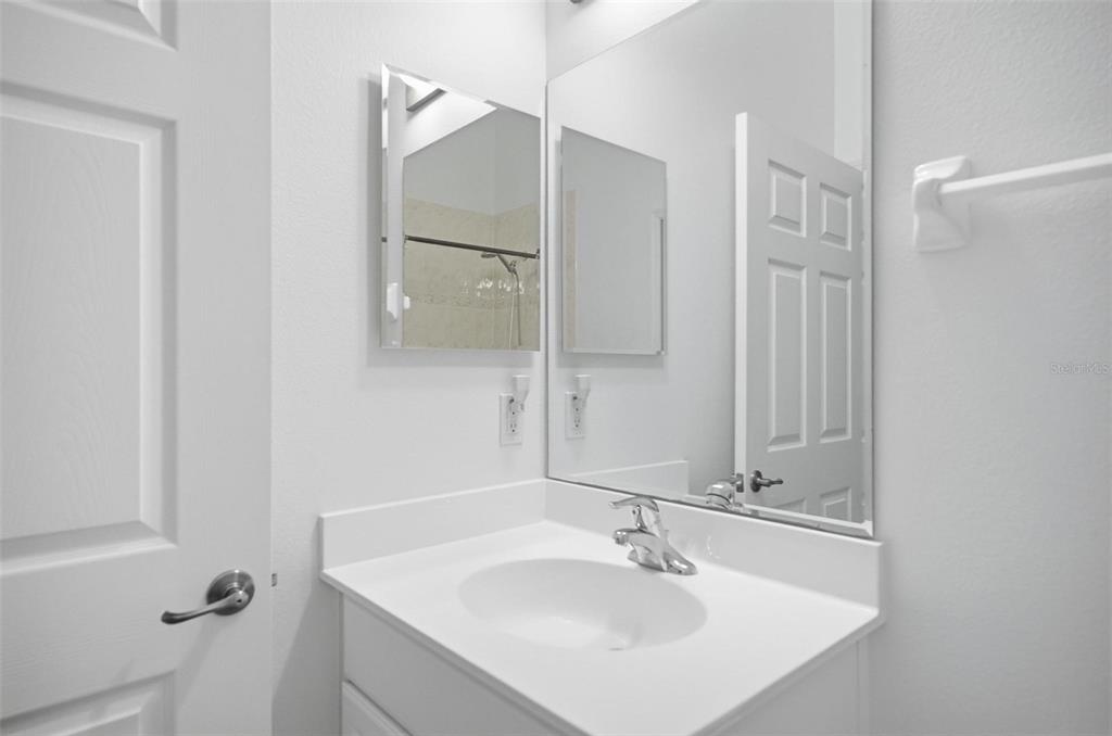 100 Canopy Walk Lane, Unit 133 Palm Coast, FL 32137 - Photo 29 of 51 a bathroom with a sink and a mirror
