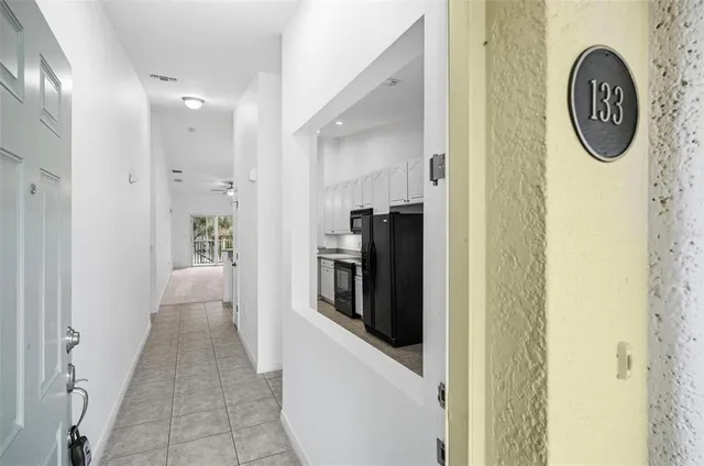 a view of a hallway with washer and dryer