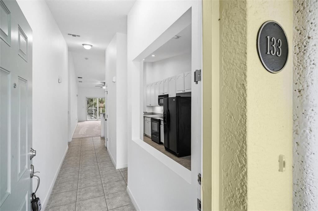 100 Canopy Walk Lane, Unit 133 Palm Coast, FL 32137 - Photo 3 of 51 a view of a hallway with washer and dryer