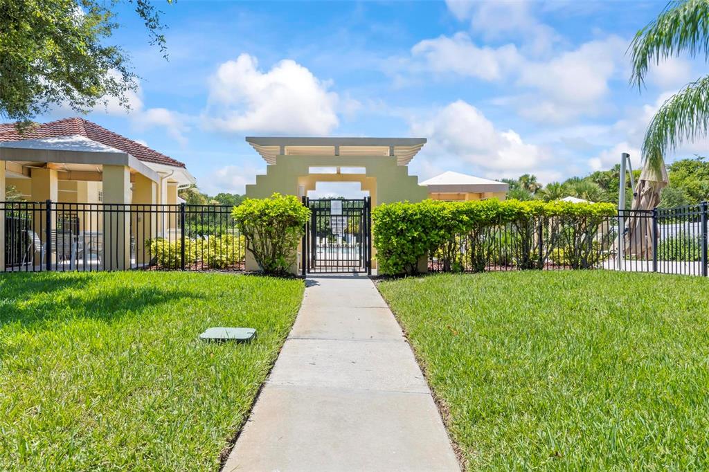 100 Canopy Walk Lane, Unit 133 Palm Coast, FL 32137 - Photo 31 of 51 a front view of a house with garden