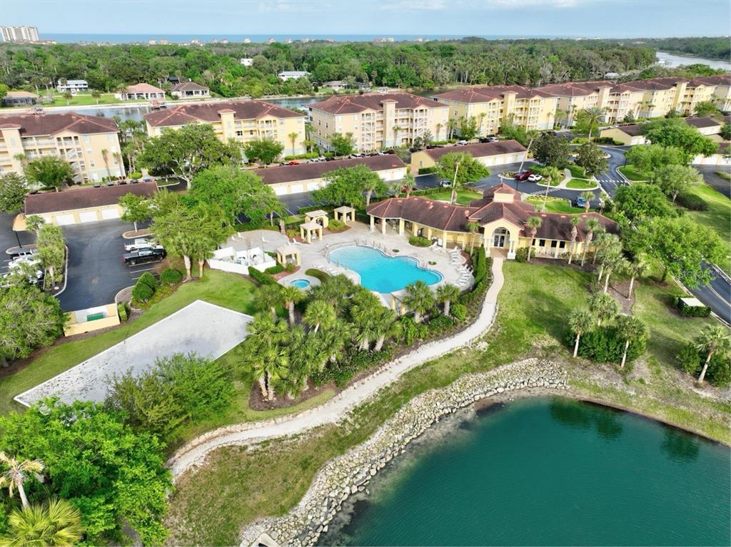 100 Canopy Walk Lane, Unit 133 Palm Coast, FL 32137 - Photo 35 of 51 an aerial view of residential houses with outdoor space and river