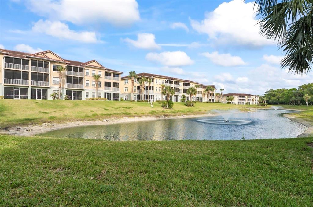 100 Canopy Walk Lane, Unit 133 Palm Coast, FL 32137 - Photo 40 of 51 a view of swimming pool and lake view