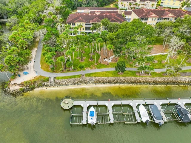 a backyard of a house with a yard and outdoor seating