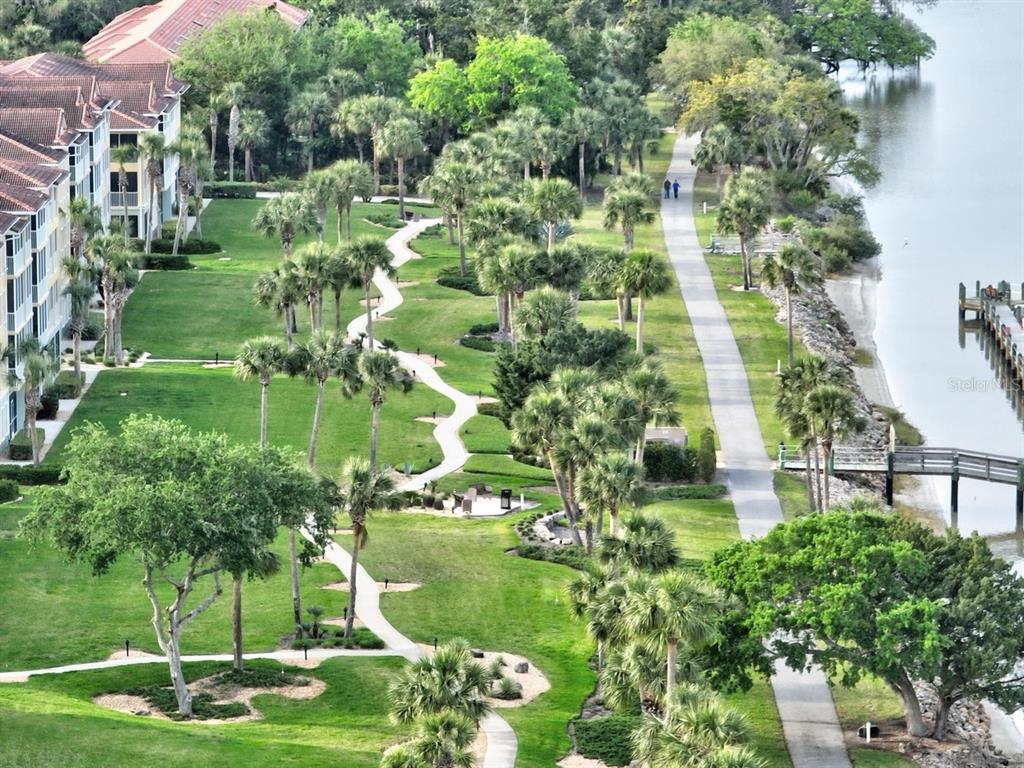 100 Canopy Walk Lane, Unit 133 Palm Coast, FL 32137 - Photo 50 of 51 a backyard of a house with a yard and outdoor seating
