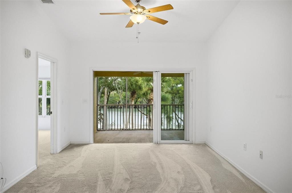 100 Canopy Walk Lane, Unit 133 Palm Coast, FL 32137 - Photo 5 of 51 an empty room with a window