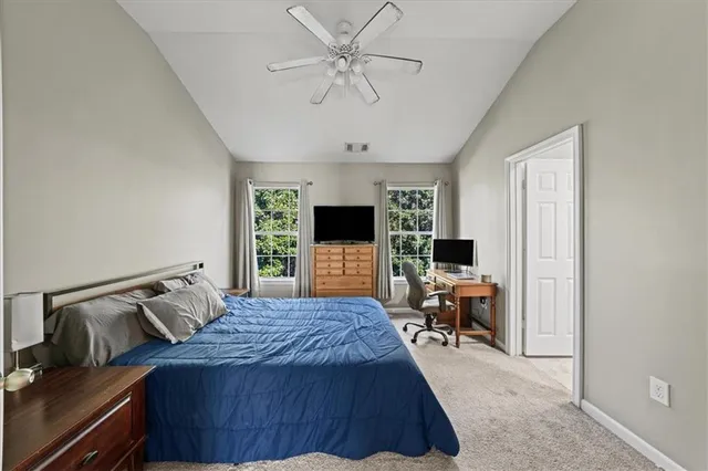 a bedroom with a bed and furniture